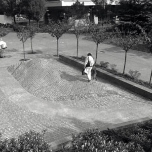 Shaped pavement area that makes the shape of a hill are fashioned with almost 4000 historic Portland cobblestones.