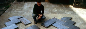 <h3>1984, Bonnie Bronson poses with her work for Southern Oregon University in the fabrication process</h3>