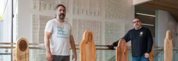 <h3>2022, Shirod Younker (left) and Tony Johnson (right) of Wanakim Collective stand next to their carvings for the interior of Oregon State University Peavy Hall</h3>